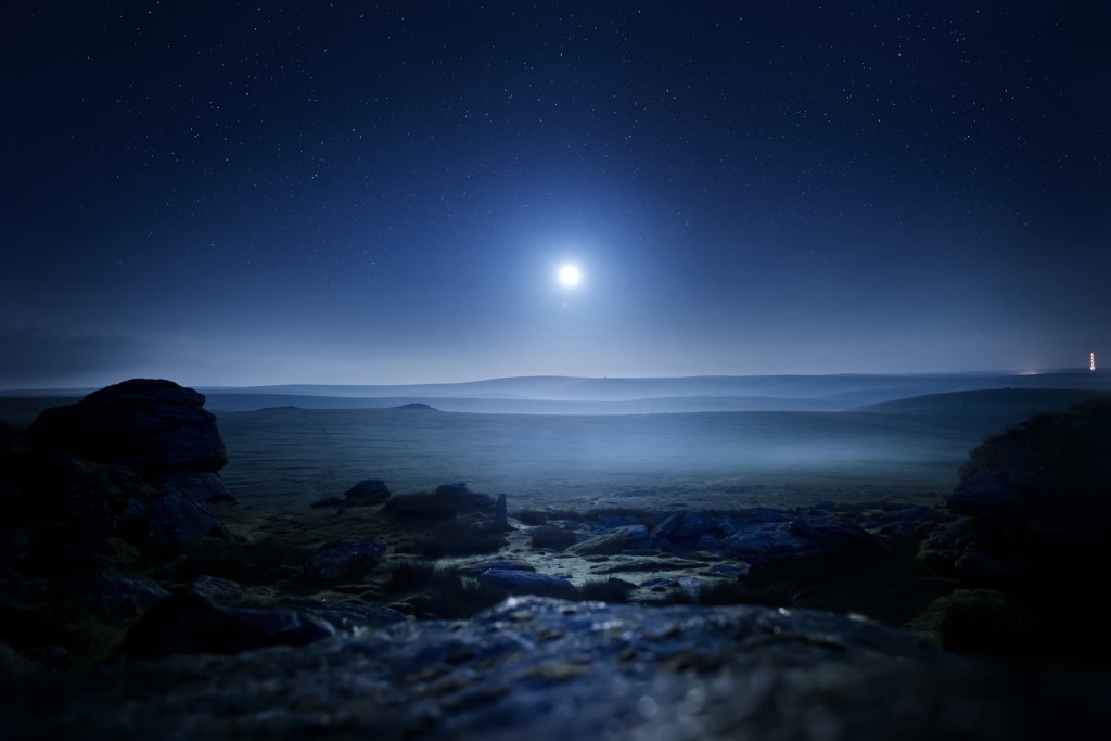 Moonlight Landscape. Glowing mist from moonlight over Dartmoor, UK.