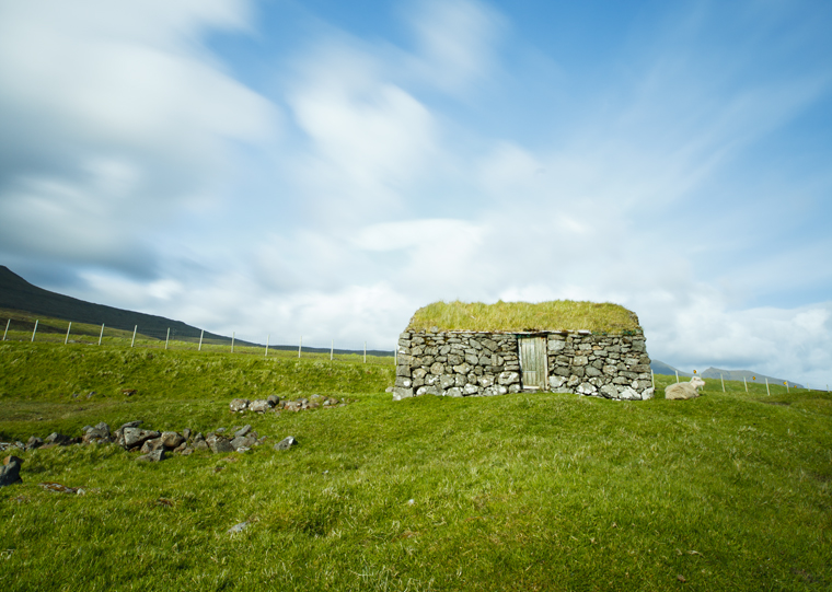 A traditionally-built stone house on the shoreline of Lake Leitisvavatn |Kimberley Coole