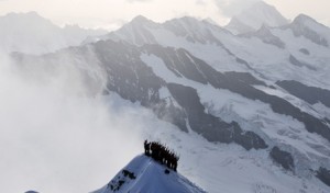 Photograph of mountain climbers on a remote peak