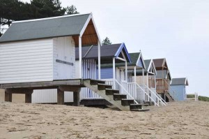 photograph of beach huts on the sand in Norfolk